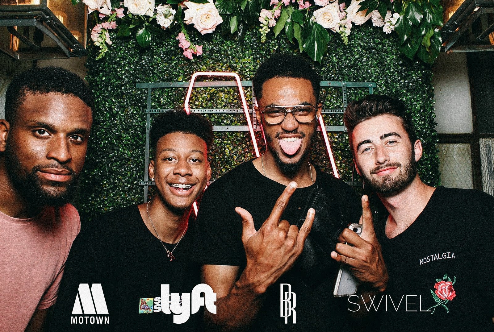 Festivalgoers posing for custom 4x6 studio prints at the Motown x Lyft lounge during the 2019 Essence Festival in Atlanta
